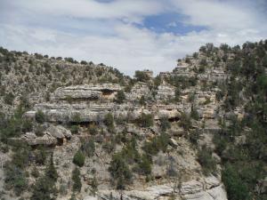 This is a view from the island towards the facing hill. You can see some cliff dwellings a bit down from the top.