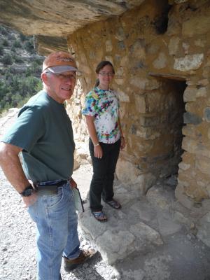 A cliff wall with a bit of reconstructed wall. Most of the walls of the dwellings in the cliff are reconstructed rather than original.