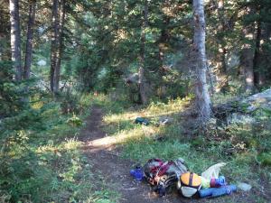 Our gear: I slept where the far sleeping bag is, between the trees it’s between, and Sarah was slung horizontally where her pile of gear is.